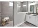 Modern bathroom showcasing a glass-enclosed shower, stylish vanity with sleek countertop, and a comfortable towel bench at 5062 Foxley Park Ln, Avon, IN 46123