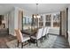 Bright dining room with large windows offering great natural light and a view, with table that seats eight at 5062 Foxley Park Ln, Avon, IN 46123