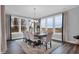 Bright dining room with large windows offering great natural light and a view, with table that seats eight at 5062 Foxley Park Ln, Avon, IN 46123