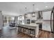 Modern kitchen features a large island with seating and stainless steel appliances at 5062 Foxley Park Ln, Avon, IN 46123