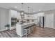 Modern kitchen features a large island with seating and stainless steel appliances at 5062 Foxley Park Ln, Avon, IN 46123