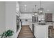 Bright, modern kitchen with stainless steel appliances and white cabinetry at 5062 Foxley Park Ln, Avon, IN 46123