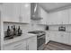 Bright kitchen featuring stainless steel appliances, white cabinets, quartz countertops, and modern backsplash at 5062 Foxley Park Ln, Avon, IN 46123