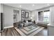 Cozy living room with a comfortable sofa, armchairs, and large window overlooking the yard at 5062 Foxley Park Ln, Avon, IN 46123