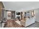 Inviting living room with fireplace, wood accent wall, and large windows at 5062 Foxley Park Ln, Avon, IN 46123