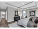 Bright main bedroom featuring a four-poster bed, soft decor, neutral color, tray ceiling, and a serene atmosphere at 5062 Foxley Park Ln, Avon, IN 46123