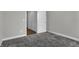Bedroom with neutral walls, carpet, and an open doorway at 5127 Foxley Park Ln, Avon, IN 46123