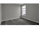 Bedroom with neutral walls, carpet, and a bright window at 5127 Foxley Park Ln, Avon, IN 46123