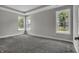 A relaxing bedroom filled with natural light from the large windows at 5127 Foxley Park Ln, Avon, IN 46123