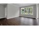 Bright dining room with modern chandelier and large windows showcasing a green outdoor view at 5127 Foxley Park Ln, Avon, IN 46123