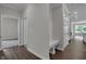 Bright foyer features convenient seating and seamless access to the kitchen and adjacent living areas at 5127 Foxley Park Ln, Avon, IN 46123