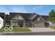 Charming single-story home featuring a covered front porch and a two-car garage on a well-manicured lawn at 5127 Foxley Park Ln, Avon, IN 46123