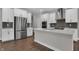 Bright modern kitchen equipped with stainless steel appliances, an expansive island, and sleek countertops at 5127 Foxley Park Ln, Avon, IN 46123