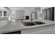 Close-up of a large kitchen island with double sink and faucet at 5127 Foxley Park Ln, Avon, IN 46123