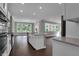 Open kitchen and living area with stainless appliances and a center island at 5127 Foxley Park Ln, Avon, IN 46123