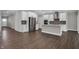 Modern open kitchen with a view into other living areas and equipped with stainless steel appliances at 5127 Foxley Park Ln, Avon, IN 46123