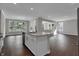 Spacious kitchen with stainless steel appliances, a center island, and grey backsplash at 5127 Foxley Park Ln, Avon, IN 46123