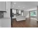 Open-concept kitchen with modern appliances, a central island, and ample counter space at 5127 Foxley Park Ln, Avon, IN 46123