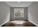 Bright living room featuring hard surface floors and a large window at 5127 Foxley Park Ln, Avon, IN 46123