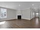 Living room with a fireplace and LVP flooring at 5127 Foxley Park Ln, Avon, IN 46123