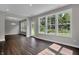 Bright living room with hardwood floors, natural light, and views into the backyard at 5127 Foxley Park Ln, Avon, IN 46123