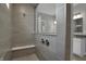 This relaxing tiled shower features a built-in bench at 5127 Foxley Park Ln, Avon, IN 46123