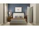 Cozy bedroom with stylish blue accent wall, nightstands, and large bed at 5208 Foxley Park Ln, Avon, IN 46123