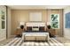 Serene bedroom with a comfortable bed, stylish decor, natural light, and a cozy seating bench at 5208 Foxley Park Ln, Avon, IN 46123