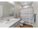 Bright bathroom features a single sink and cabinet, mirror, and shower with curtain at 5375 Citadel Dr, Noblesville, IN 46062