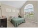 Vaulted ceiling bedroom with a lovely arched window, carpet flooring, and simple decor at 5375 Citadel Dr, Noblesville, IN 46062
