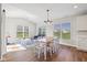 Bright dining area with a table, large windows, and access to adjacent sitting area at 5375 Citadel Dr, Noblesville, IN 46062