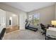 Brightly lit room with a treadmill and a view to the outdoors via a large window at 5375 Citadel Dr, Noblesville, IN 46062