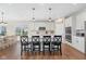 Well-appointed kitchen with stainless steel appliances, white cabinets, and a center island with seating at 5375 Citadel Dr, Noblesville, IN 46062