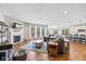 Open concept living area featuring hardwood floors, fireplace and ample seating at 5375 Citadel Dr, Noblesville, IN 46062