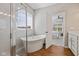 Modern primary bathroom featuring a soaking tub, a walk-in shower, and ample counter space at 5375 Citadel Dr, Noblesville, IN 46062
