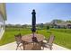 Enjoy the outdoors on this home's patio, complete with outdoor seating and a large, manicured lawn at 5375 Citadel Dr, Noblesville, IN 46062