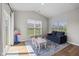 Cozy playroom with a sofa, table, and large windows offering plenty of natural light at 5375 Citadel Dr, Noblesville, IN 46062