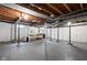 Unfinished basement featuring concrete floors, exposed wood ceiling and support beams at 5439 Indianola Ave, Indianapolis, IN 46220