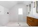 Modern bathroom with white subway tile, hexagon tile floor, and a floating vanity at 5439 Indianola Ave, Indianapolis, IN 46220