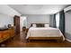 Bedroom with hardwood floors, natural light, and modern decor at 5439 Indianola Ave, Indianapolis, IN 46220