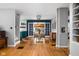 Open-concept dining room boasts hardwood floors and seamlessly connects living spaces at 5439 Indianola Ave, Indianapolis, IN 46220