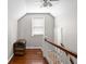 Hallway with hardwood floors and window overlooking the front yard at 5439 Indianola Ave, Indianapolis, IN 46220