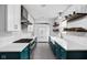 Modern kitchen features white subway tile, dark blue cabinetry, and sleek countertops at 5439 Indianola Ave, Indianapolis, IN 46220
