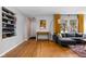 Living room with hardwood floors, a gray sectional sofa and modern decor at 5439 Indianola Ave, Indianapolis, IN 46220