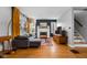 Living room showcasing hardwood floors, modern decor, and a cozy fireplace at 5439 Indianola Ave, Indianapolis, IN 46220