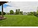 Spacious backyard features a gravel fire pit area with scenic pond at 5507 Wakefield Rd, Greenwood, IN 46142