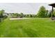 Expansive backyard featuring a gravel fire pit area with inviting seating at 5507 Wakefield Rd, Greenwood, IN 46142