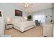 Bedroom with vaulted ceiling, neutral carpet, white furniture, and desk with grey chair at 5507 Wakefield Rd, Greenwood, IN 46142