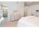 Bright bedroom with light blue walls, grey furniture, and an ensuite bathroom at 5507 Wakefield Rd, Greenwood, IN 46142