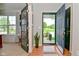 Bright entryway showcasing natural light, hardwood floors, and an open doorway to the home's interior at 5507 Wakefield Rd, Greenwood, IN 46142